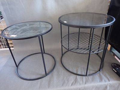 two tables that are sitting on a table cloth