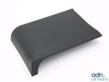the back of a black leather wallet on a white surface
