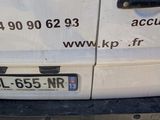 a white van that has a sign on the side of it