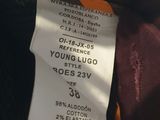 a close up of a label on a brown jacket