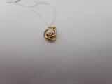 a gold plated necklace with a pearl on a white background