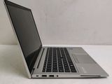 a laptop computer sitting on a table with a white background