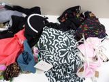a pile of clothes that is on a white table