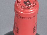 a bottle of wine that has a red label on it