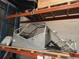 a car that is sitting on a shelf in a garage