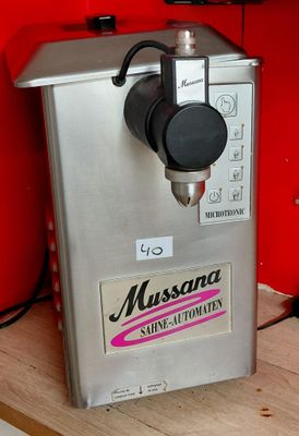 a machine that is sitting on top of a wooden table