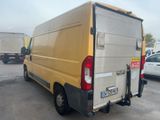 a yellow van that is parked in a parking lot