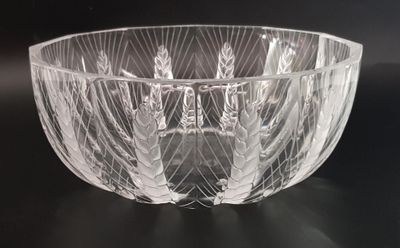 a glass bowl that is sitting on a table