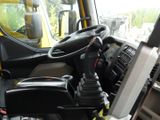 a steering wheel in the driver ' s seat of a truck