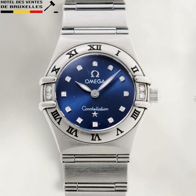 an image of a close up of a wrist watch with roman numerals