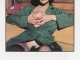 an advertisement for a magazine with a woman holding a baby
