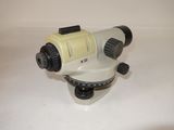 an image of a close up of a tripod on a white surface