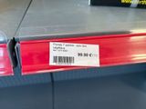 a picture of a red shelf with a price tag on it