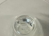 a glass bowl with water in it sitting on a table