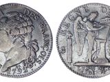 a silver coin with an image of a woman and a man on it