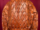 an image of a brown leather jacket on a mannequin mannequin
