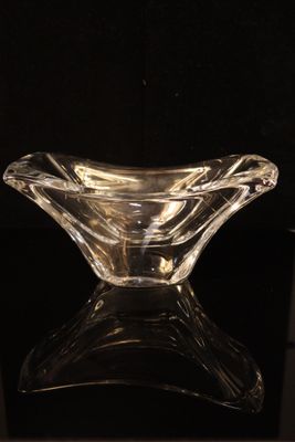 a glass bowl that is sitting on a table