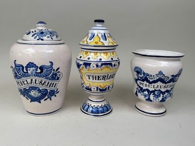 three vases that are sitting next to each other on a table