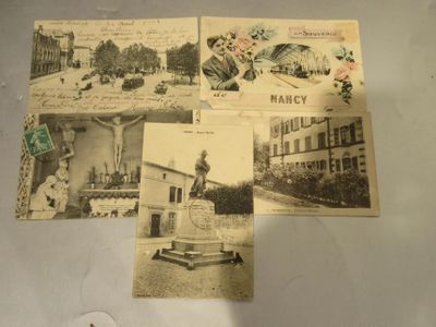 several old postcards of old buildings and a statue on a table