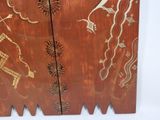 a wooden cabinet with a design on it