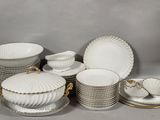 a lot of plates and bowls on the table