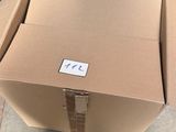 a box that is sitting on the floor in front of a printer