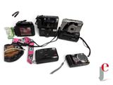 a lot of cameras that are sitting on a table