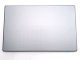 a silver laptop computer sitting on a white surface