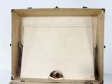 an open suitcase with a cat in it on a table