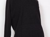 a woman ' s black sweater with a yellow v - neck on a mannequin mannequin