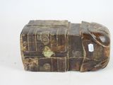 an old trunk that is sitting on a white surface