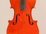 an orange violin with a black bow on a white background