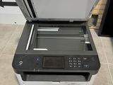 a printer that is sitting on the floor in the room