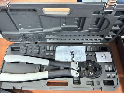 a tool in the case that is open on the table