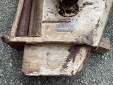 a rusted fire hydrant sitting on the side of the road