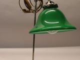 an image of a green desk lamp on a metal stand