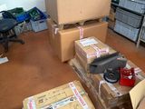 many boxes that are sitting on the floor in the room