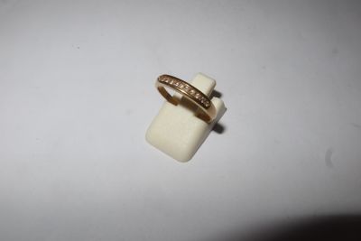a close up of a ring on top of a white object