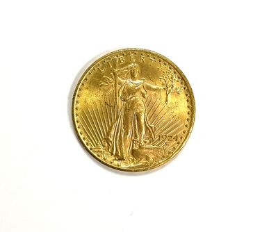 a close up of a gold coin on a white surface