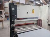 a machine that is working on a sheet of paper