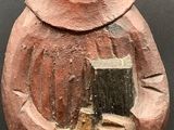 statue of a woman holding a book and a book in her hands