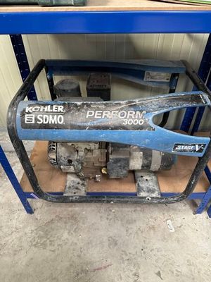 the generator is sitting on the cart in the garage