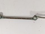 a metal object on a white surface with a white background