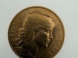 an image of a gold coin with a woman ' s face on it