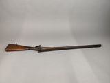 a rifle with a wooden barrel on a white background