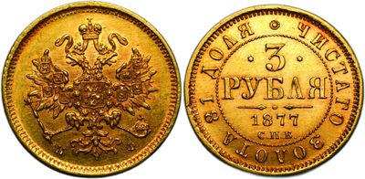 a gold coin with the image of a crown on it