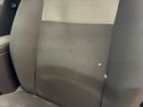 a dirty seat in the back of a car