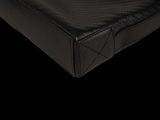 a close up view of a mattress with a black cover
