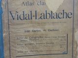 a sign on the wall of a building that reads atlas clas vidal lablache