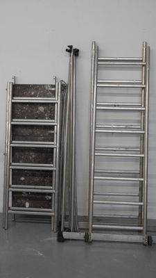 three ladders that are next to each other in a room